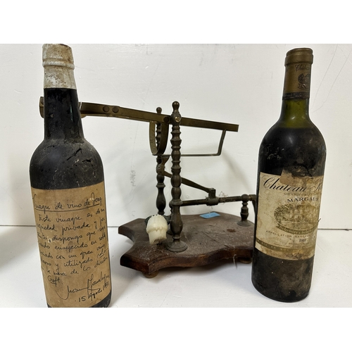 53 - A brass framed Port purer and two bottles of wine to include Chateau Kirwan Margaux, A/F  Location:
... 