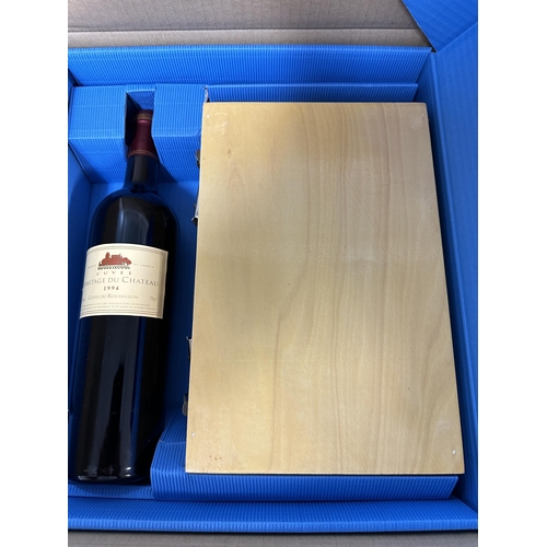 54 - A single bottle of Ermitage du Chateau Cotes du Roussillon 1994 and a wooden cases of Boule balls,  ... 