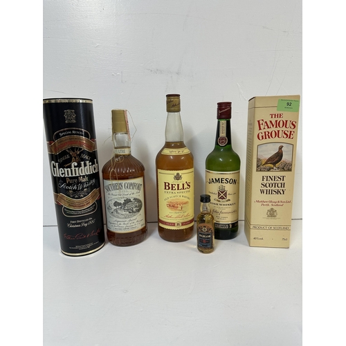 92 - Five bottles of Whisky and a miniature to include The Famous Grouse, Bells, Jameson, Glenfiddich, So... 