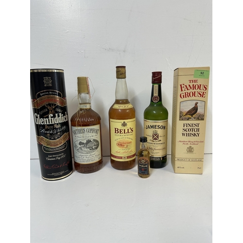 92 - Five bottles of Whisky and a miniature to include The Famous Grouse, Bells, Jameson, Glenfiddich, So... 