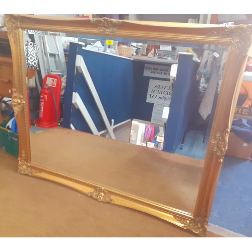 306 - A large gold painted wall mirror, 106cm x 130cm. Location:RWB