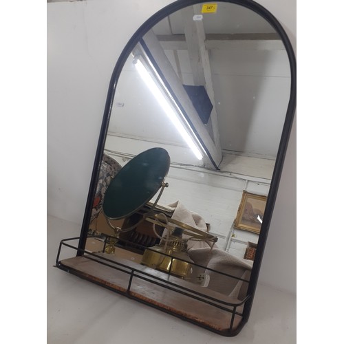 347 - A modern black framed, arched mirror with incorporated shelf together with a brass dressing table sw... 