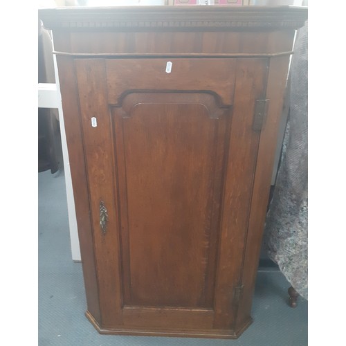 315 - A Georgian oak corner cabinet, 105cm High having 3 internal shelves together with a satinwood pot cu... 