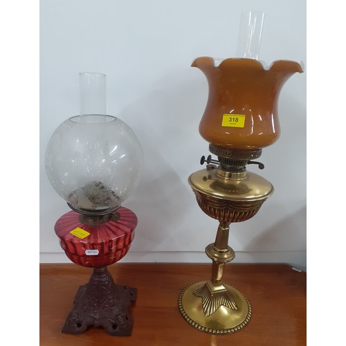 318 - Two Victorian oil lamps, one having a ruby glass reservoir. Location:A1M