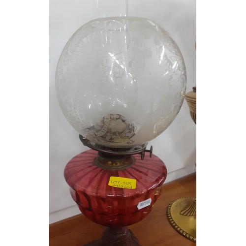 318 - Two Victorian oil lamps, one having a ruby glass reservoir. Location:A1M