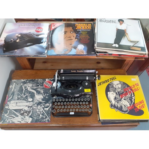 322 - A vintage Smith Premier typewriter together with a quantity of 1970's LP's to include Deep Purple, J... 