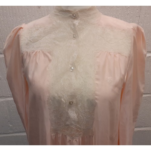 10 - Christian Dior- A pink satin full length ladies night gown having cream lace insertions, approx 36/3... 