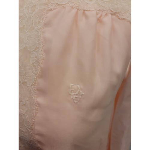 10 - Christian Dior- A pink satin full length ladies night gown having cream lace insertions, approx 36/3... 