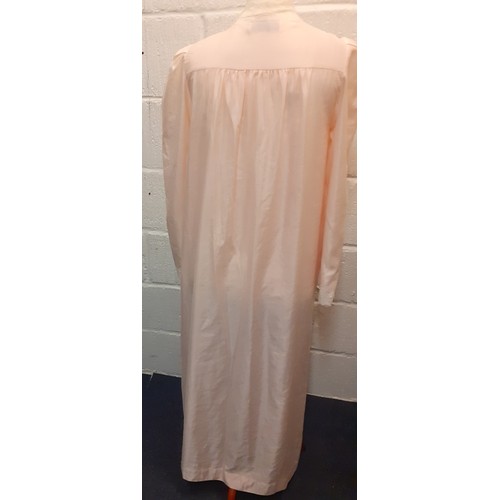 10 - Christian Dior- A pink satin full length ladies night gown having cream lace insertions, approx 36/3... 