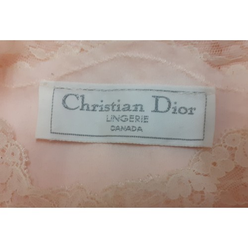 10 - Christian Dior- A pink satin full length ladies night gown having cream lace insertions, approx 36/3... 