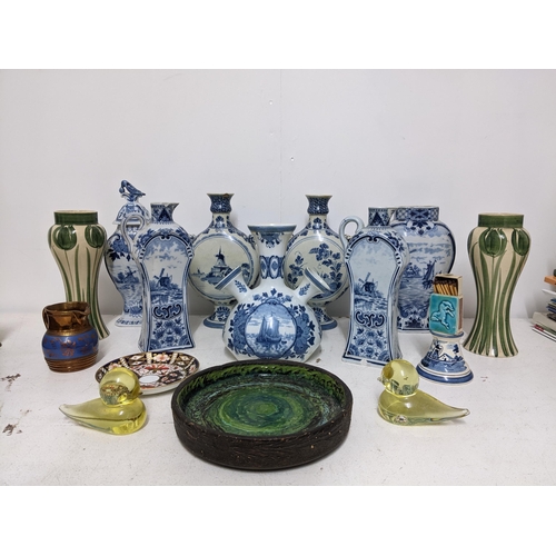 264 - A mixed lot of ceramics and glassware to include various pairs of Delft pottery jugs and vases, Swed... 