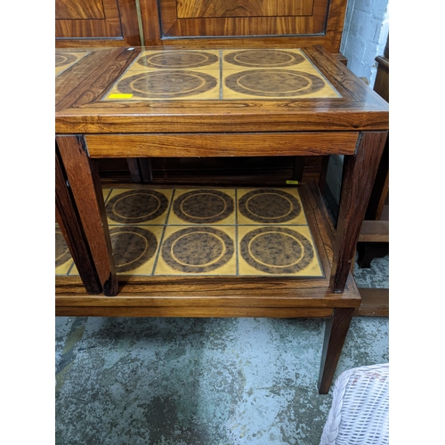 278 - A Moluna Mobler Danish rosewood and tile topped nest of three coffee tables, the largest 41cm x 116c... 