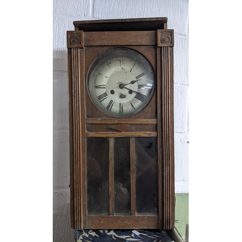 298 - A selection of clocks and clock parts to include a F.W Elliott Post Office dial clock with an 8