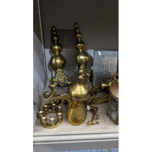 302 - Mixed metalware to include a brass Middle Eastern engraved tray, a boot jack, dallah coffee pot and ... 