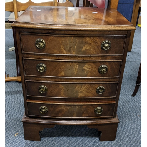 329 - A reproduction mahogany bow fronted chest of four drawers on bracket shaped feet, 59cm h x 45.5cm w
... 