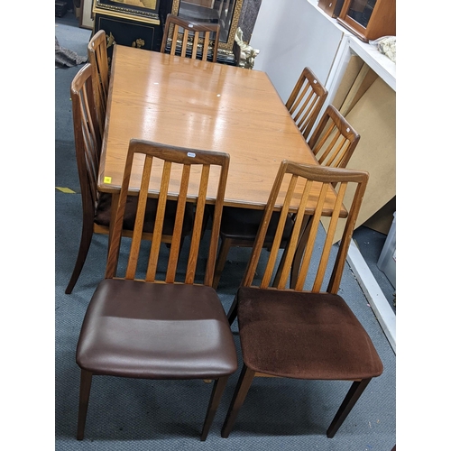 333 - A G-plan teak Fresco range extending dining table, 73cm h x 152.5cm w (unextended) together with eig... 