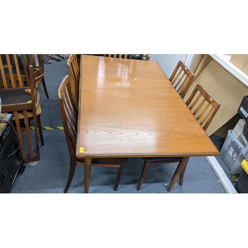 333 - A G-plan teak Fresco range extending dining table, 73cm h x 152.5cm w (unextended) together with eig... 