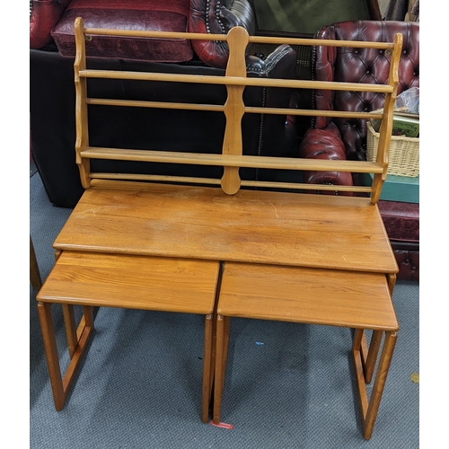 334 - A retro teak nest of three tables, the largest 48.5cm h x 104cm w, together with an Ercol beech wall... 