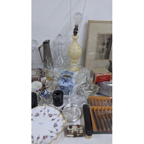 338 - A mixed lot to include a silver plated entree dish, Chinese scent bottles, decanters, signed engravi... 