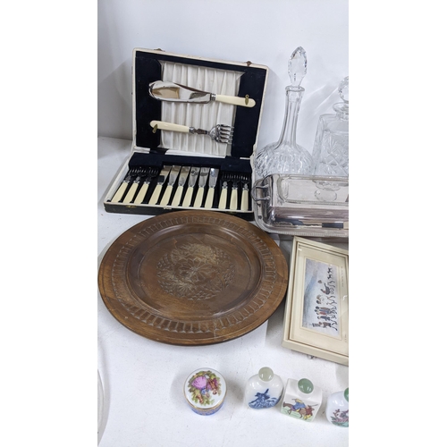 338 - A mixed lot to include a silver plated entree dish, Chinese scent bottles, decanters, signed engravi... 