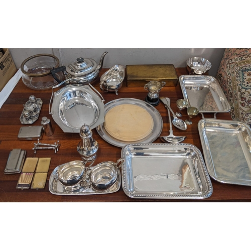 361 - A collection of silver plate items to include three trays, a tea pot, a condiment set, milk jugs and... 