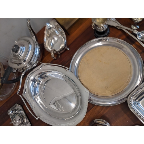 361 - A collection of silver plate items to include three trays, a tea pot, a condiment set, milk jugs and... 