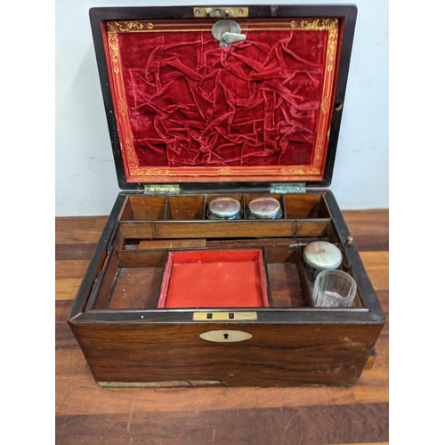 363 - A late 19th/early 20th century vanity box with many compartments, pull-out drawer and mother of pear... 