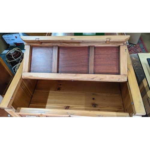 375 - A Chinese pine cabinet, the front inlaid with bone panels and having a hinged top revealing storage ... 