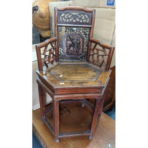 376 - A Chinese side chair having a bamboo style frame and the pierced splat decorated with a scene of a w... 