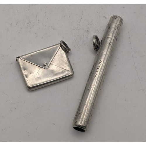 75 - A silver stamp case fashioned as a letter, hallmarked Birmingham 1904, together with a silver propel... 