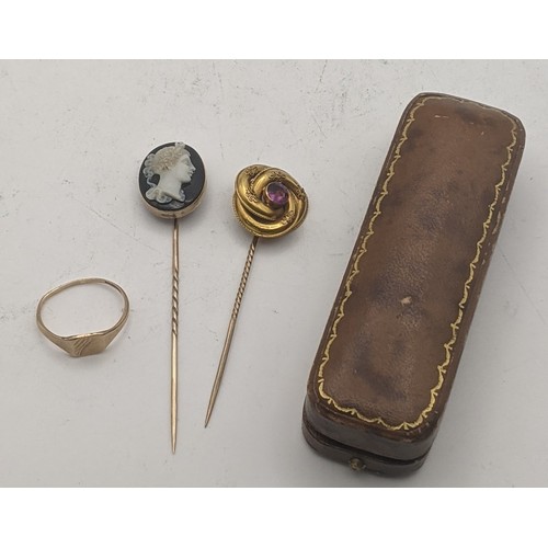 76 - A yellow gold cameo stick pin, tested as 9ct gold, together with a Victorian yellow metal stick pin ... 