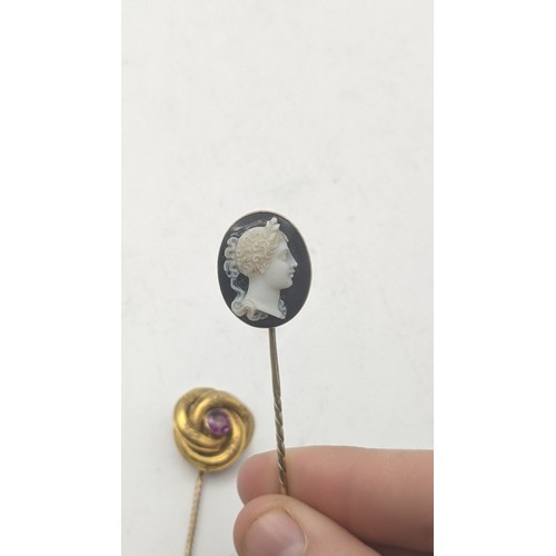 76 - A yellow gold cameo stick pin, tested as 9ct gold, together with a Victorian yellow metal stick pin ... 