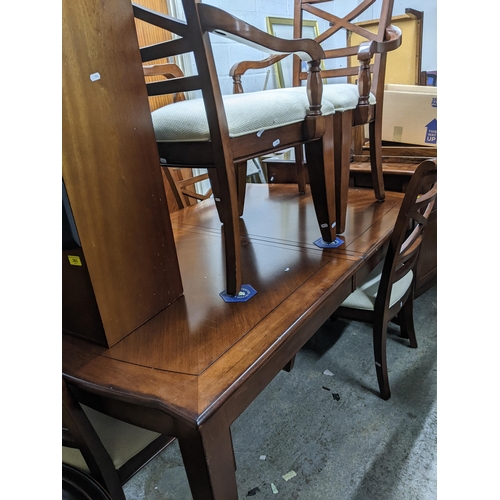 277 - A modern extending dining room table with two extra leaves 77cm x approx.65 (when unextended) x 104c... 