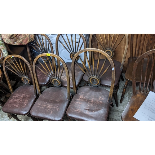 281 - A set of six early 20th century Windsor target and fan back dining chairs with leather upholstered s... 