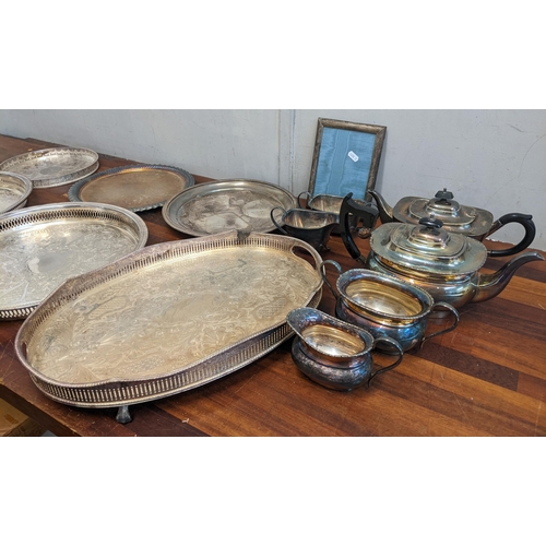 368 - A collection of silver plated items to include two tea sets, six tea trays, and a photo frame Locati... 