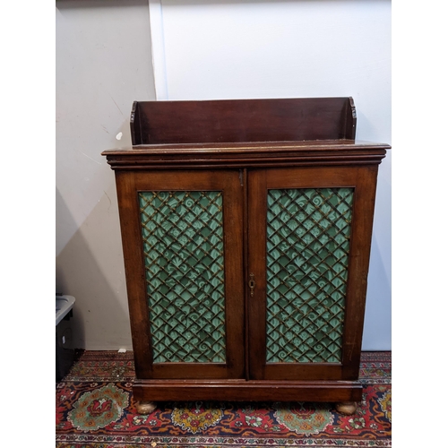 527 - A Regency mahogany chiffonier with an upstand over a pair of brass lattice panelled doors, 92cm h x ... 