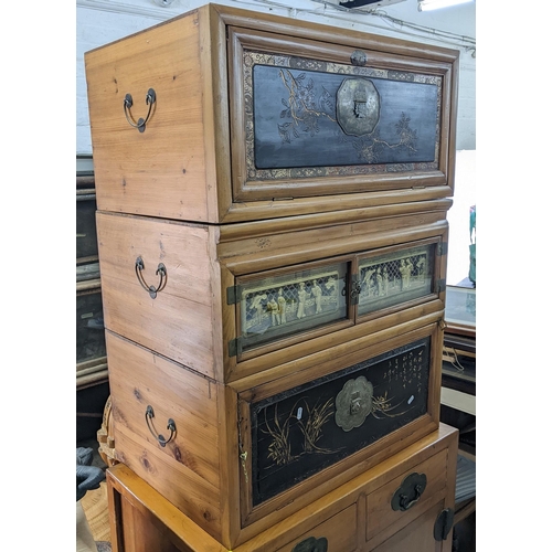 374 - A set of three Chinese light elm and pine stacking cabinets, two having a fall flap panelled door an... 