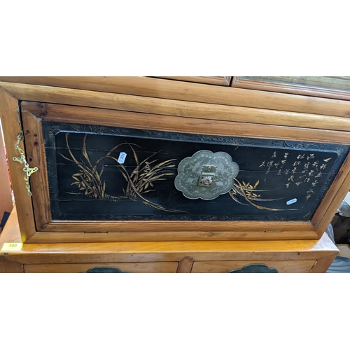 374 - A set of three Chinese light elm and pine stacking cabinets, two having a fall flap panelled door an... 