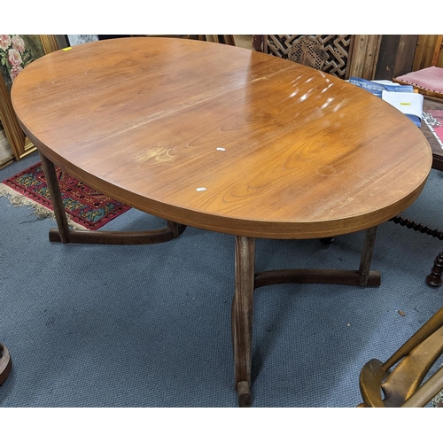 423 - A mid 20th century Danish teak oval topped dining table, attributed to Johannes Anderson, 73.5cm h x... 