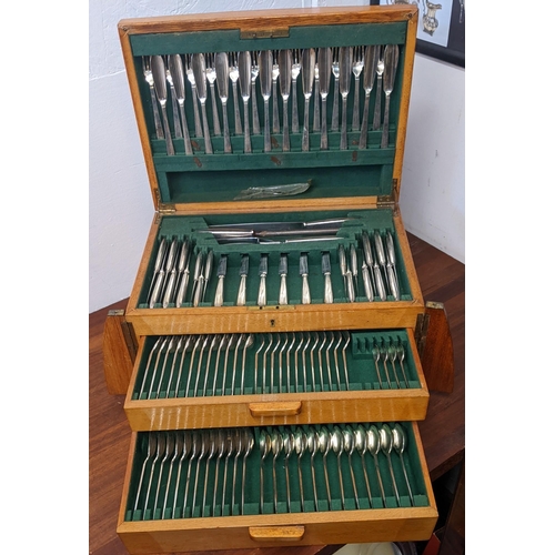 431 - An Art Deco style early/mid 20th century canteen of cutlery with two drawers and a lift-open compart... 