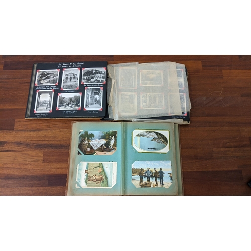 433 - Two vintage albums to include one with postcards from around the UK, and another with photographs, m... 