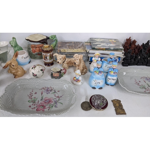 449 - A mixed lot to include an Indonesian chess set, Chinese related books, character mugs and other item... 