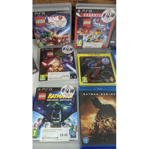 478 - A mixed lot to include PS3 and PS4 games to include Batman Arkham City and others along with DVDs to... 