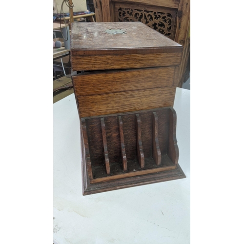 485 - A late 19th/early 20th century oak table top stationery box with fitted compartments and letter rack... 