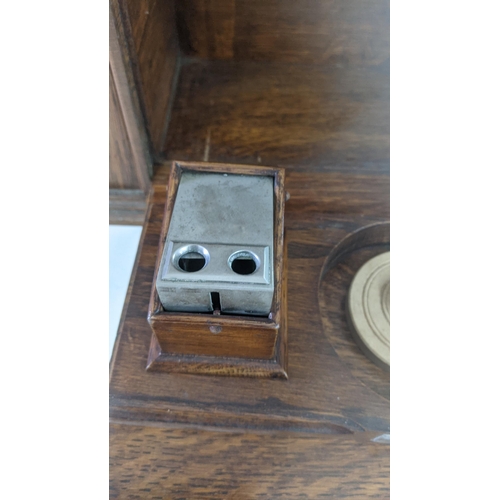 485 - A late 19th/early 20th century oak table top stationery box with fitted compartments and letter rack... 