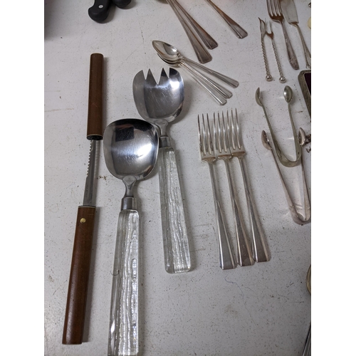 395 - A mixed lot of British, German, and Scandinavian silver plate, stainless steel and other flatwares, ... 