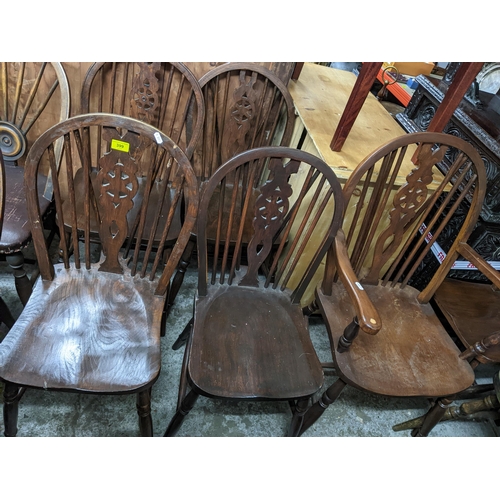 399 - A set of five Windsor wheelback standard dining chairs and a matched carver chair, along with a pink... 