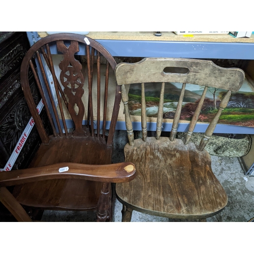 399 - A set of five Windsor wheelback standard dining chairs and a matched carver chair, along with a pink... 