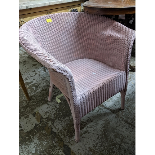 399 - A set of five Windsor wheelback standard dining chairs and a matched carver chair, along with a pink... 