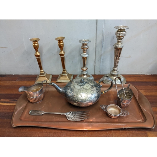 460 - Metalware to include a pair of George III candlesticks, an artis and crafts tray, tea ware and other... 